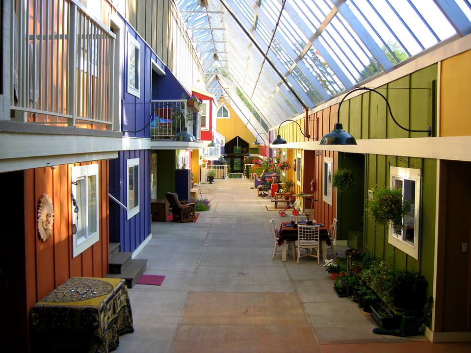 A colourful, double-loaded corridor at Windsong Cohousing