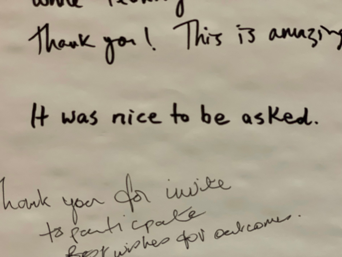 Some text on a large piece of paper, left by participants: "It was nice to be asked."