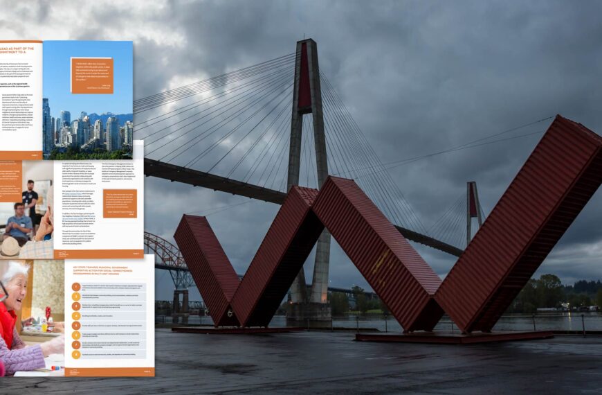 Some spreads from a practice guide float in the foreground with a bridge and public art from New Westminster in the background on a dark cloudy morning.